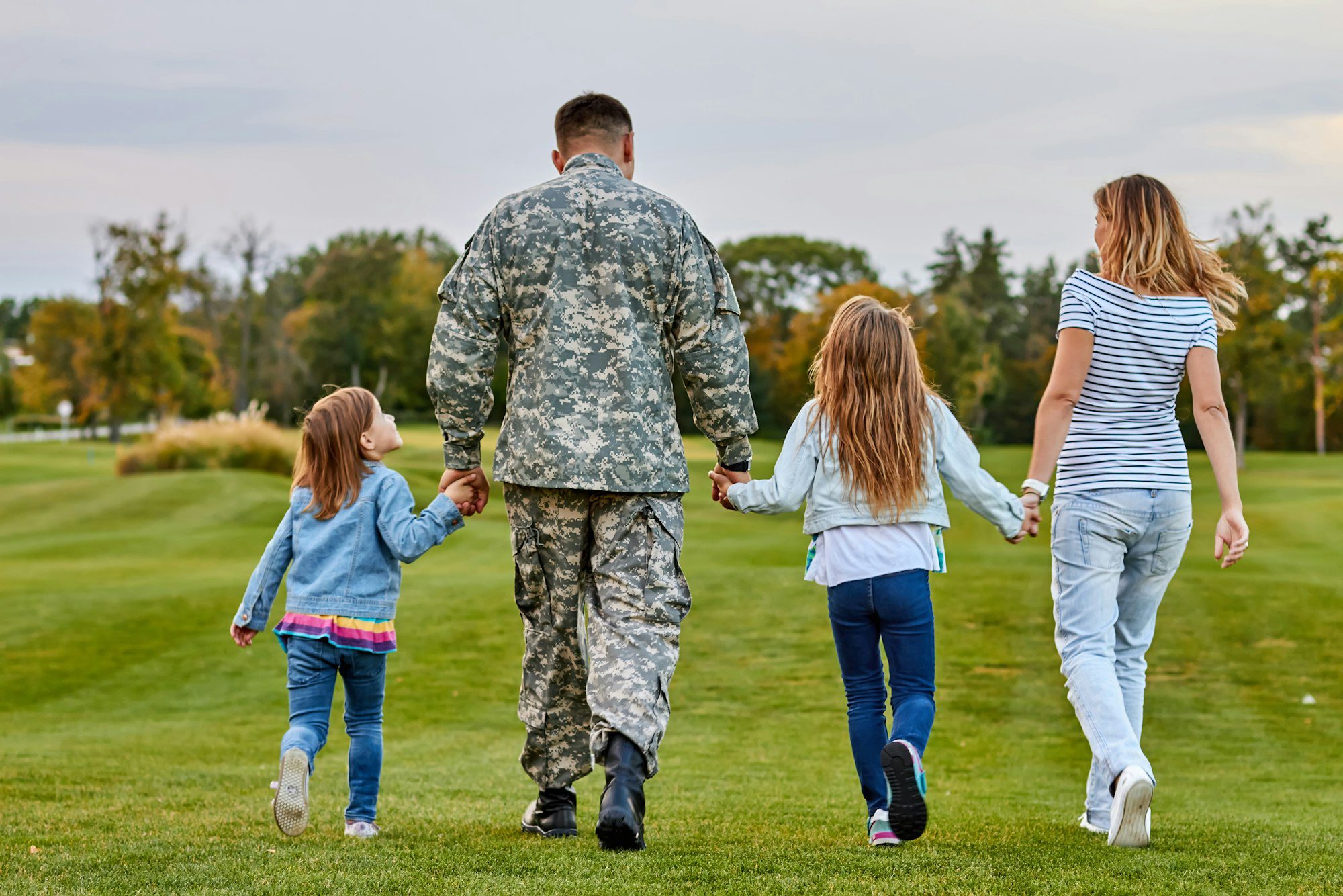 back view soldier s family walking