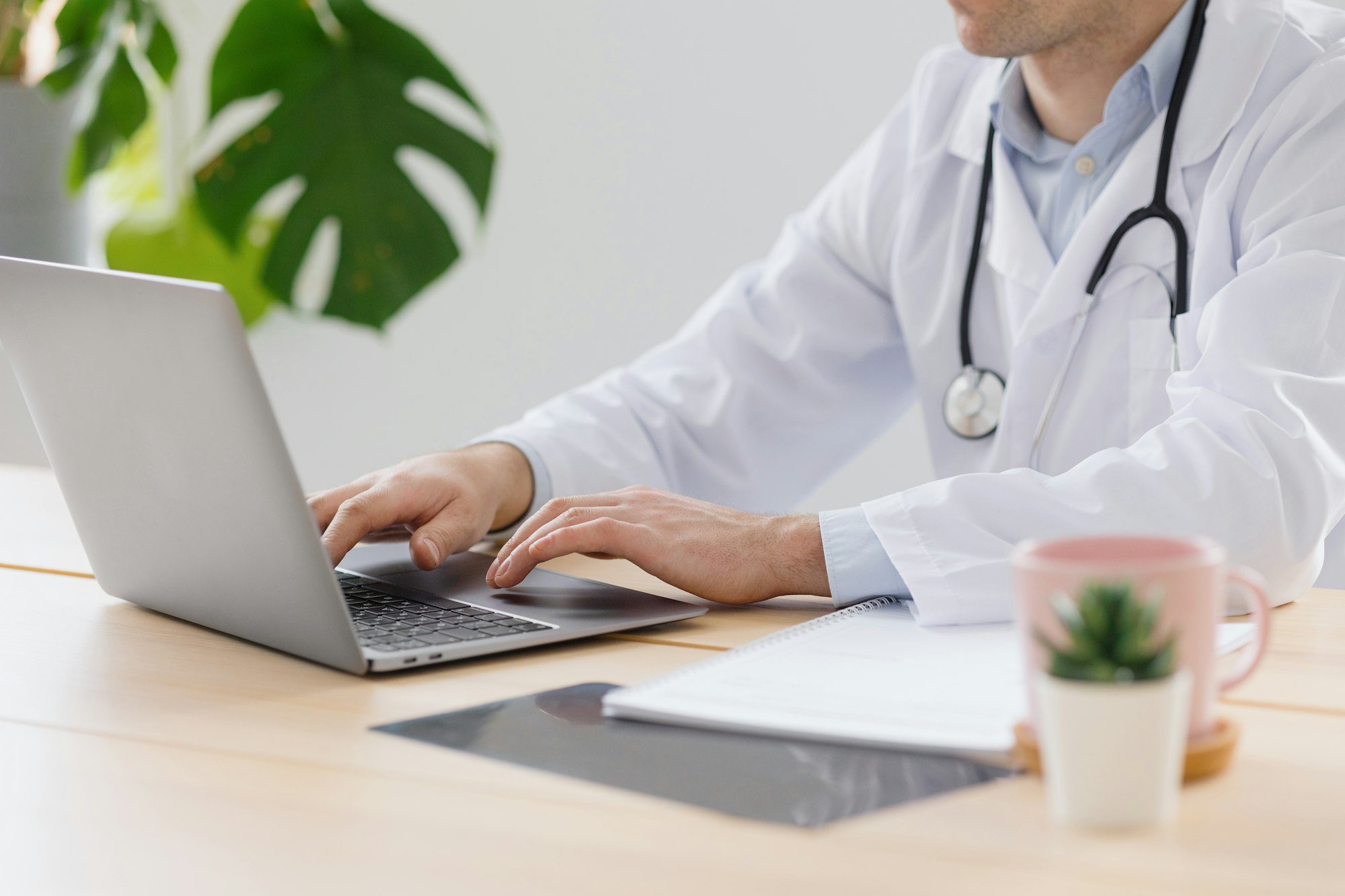 telemedicine doctor in a white coat and glasses communicates with a patient