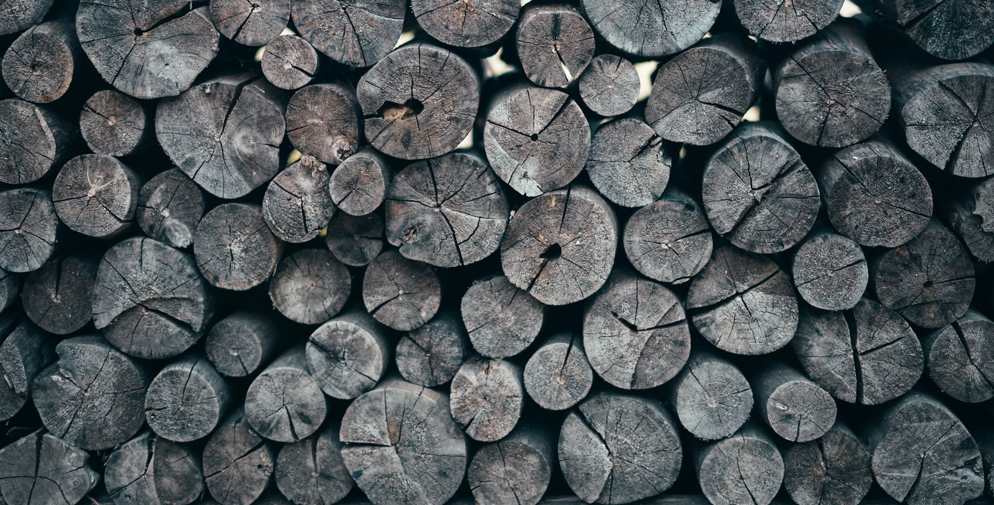 stack of old firewood or wood stump background